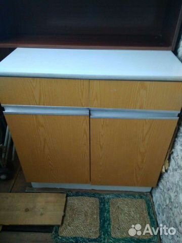 Кухонный стол с ящиками и полками внутри